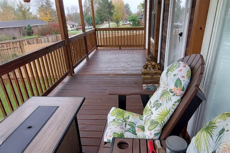 Brown-stained 8x12 covered porch extension attached to a white house in Adairville, Kentucky.