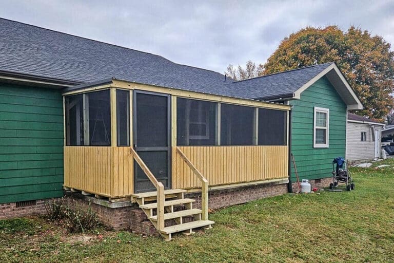 8x20 screened porch with wood framing and steps attached to a green house in Rickman, Tennessee.