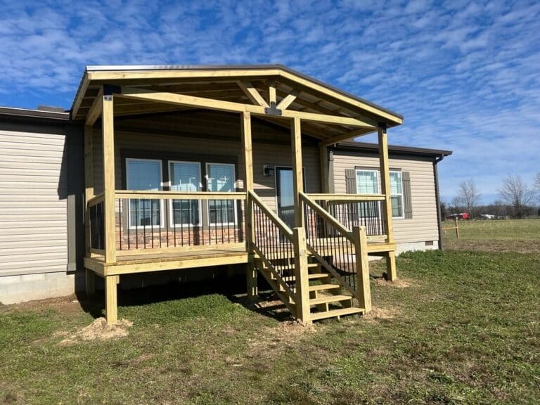 Side view of an 8x22 porch with a metal A-frame roof and 6x6 support posts in Morrison, Tennessee.