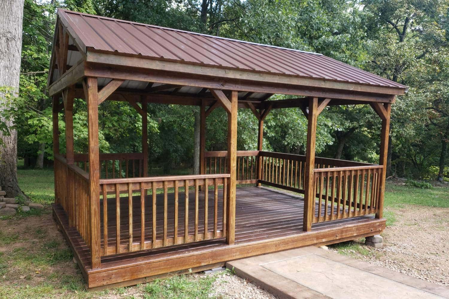 prebuilt pavilions in kentucky on foundation besides path in woods