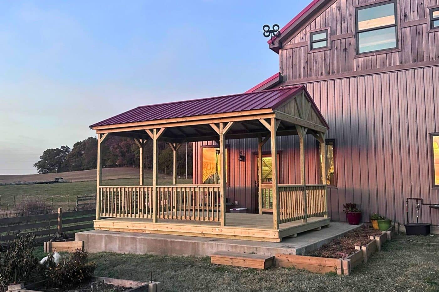 Pavilion on concrete foundation besides barn in Tennessee