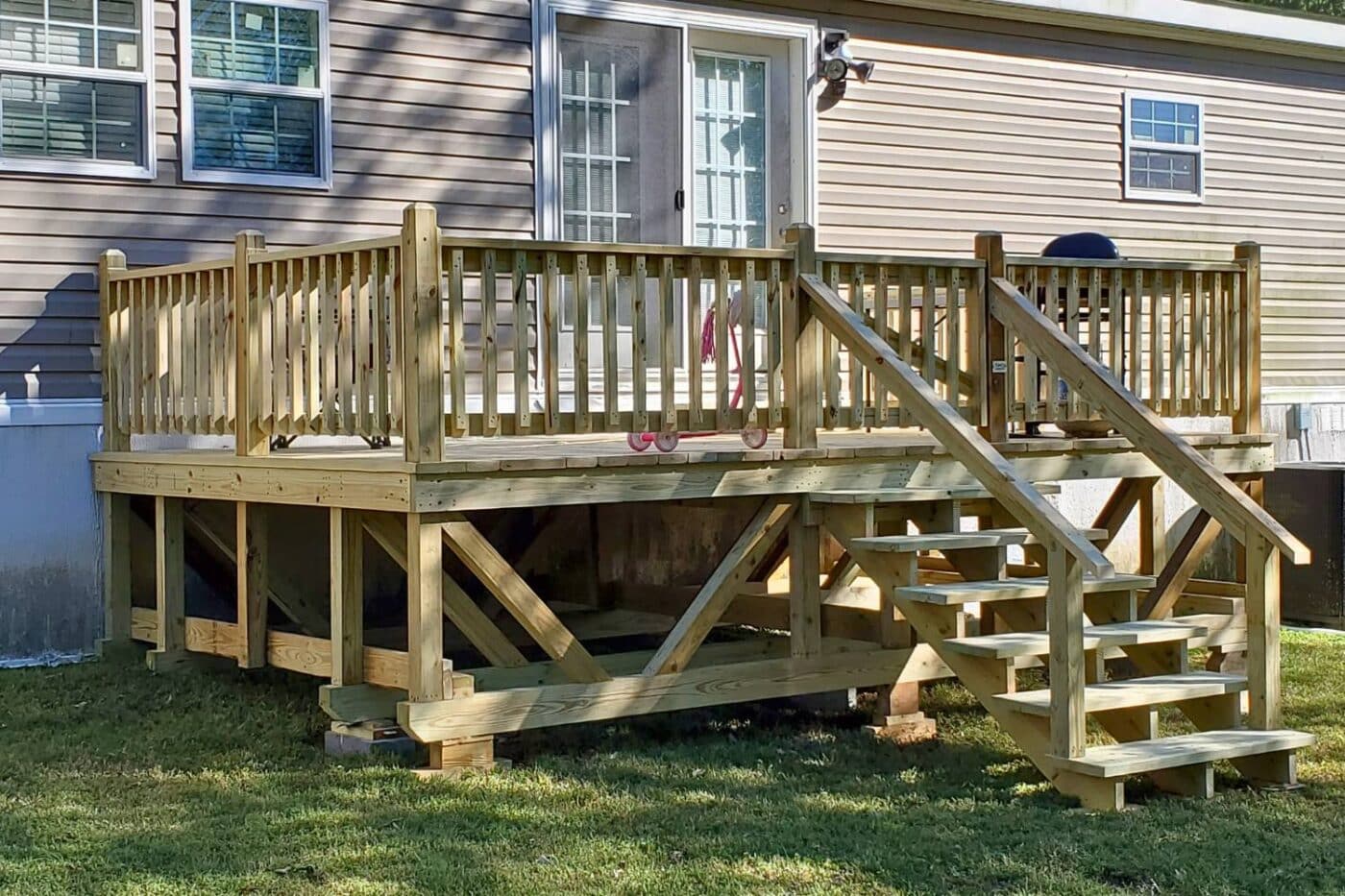 Mobile Home Deck attached to home with concrete blocks and steps