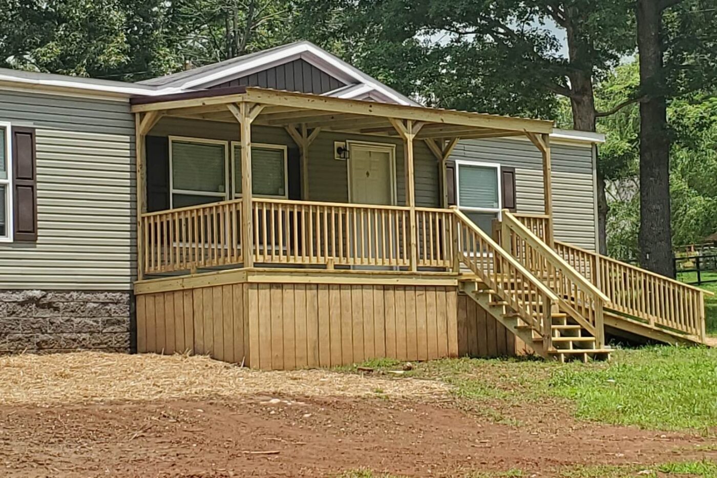 Prebuilt Porches in Kentucky 9 Wooden mobile home porch with steps, railing, and roof outside Kentucky mobile home