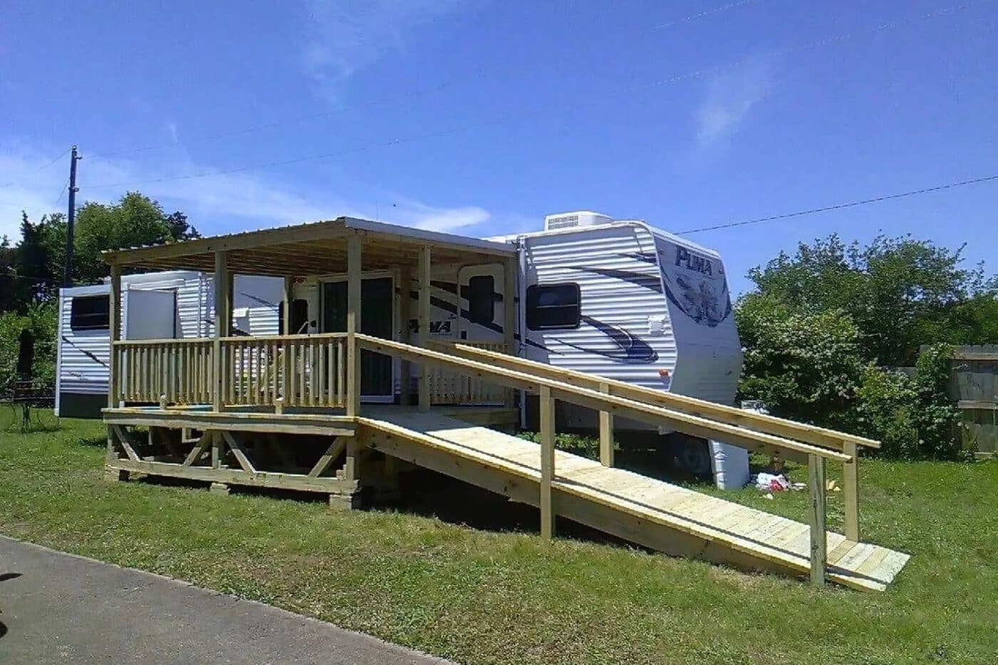 RV porch with view of long ramp and railings
