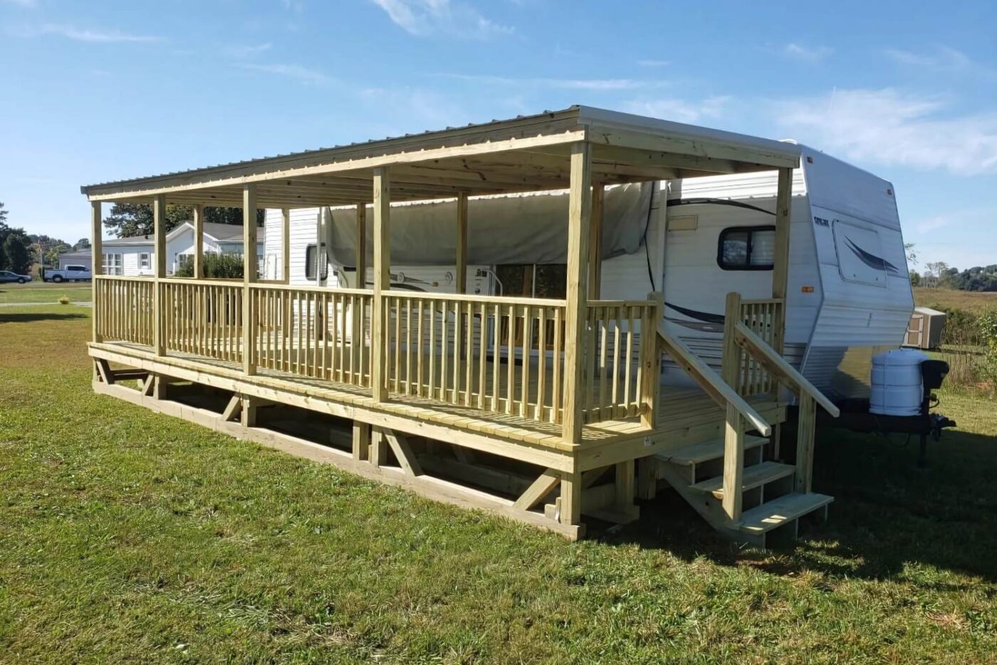 Prebuilt Porches in Kentucky 10 RV Porch attached to white RV in front of corn field with small set of stairs