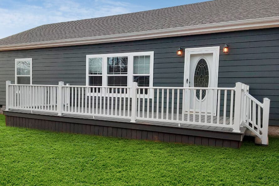 vinyl porch with white railing on front of gray home